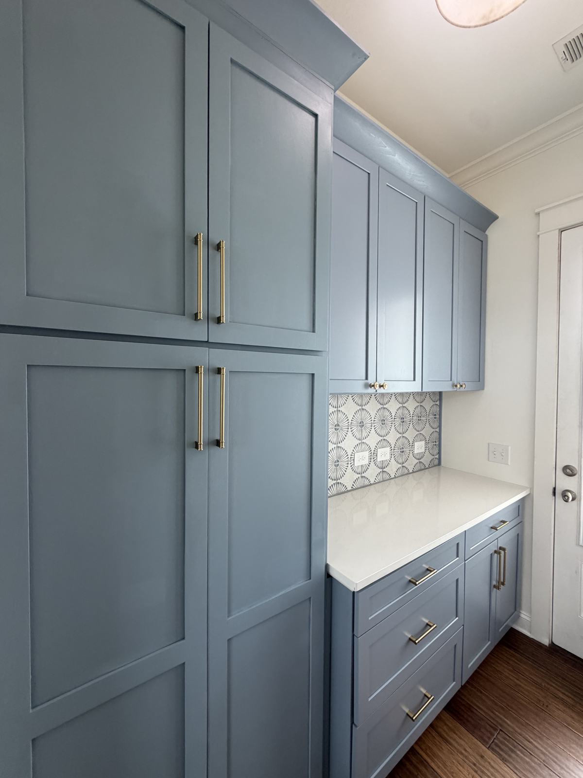 Custom butler's pantry: painted shaker cabinetry, brass hardware, patterned tile backsplash, and a quartz counter, Mount Pleasant SC