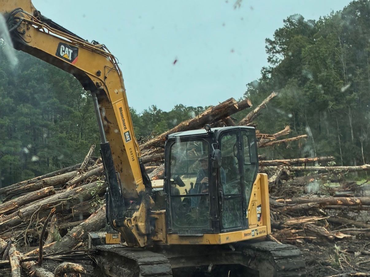 Firm Foundation's excavator clearing timber on a Lowcountry site